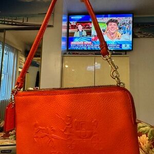 $128-Coach Red Pebbled Leather Embossed Wristlet great color